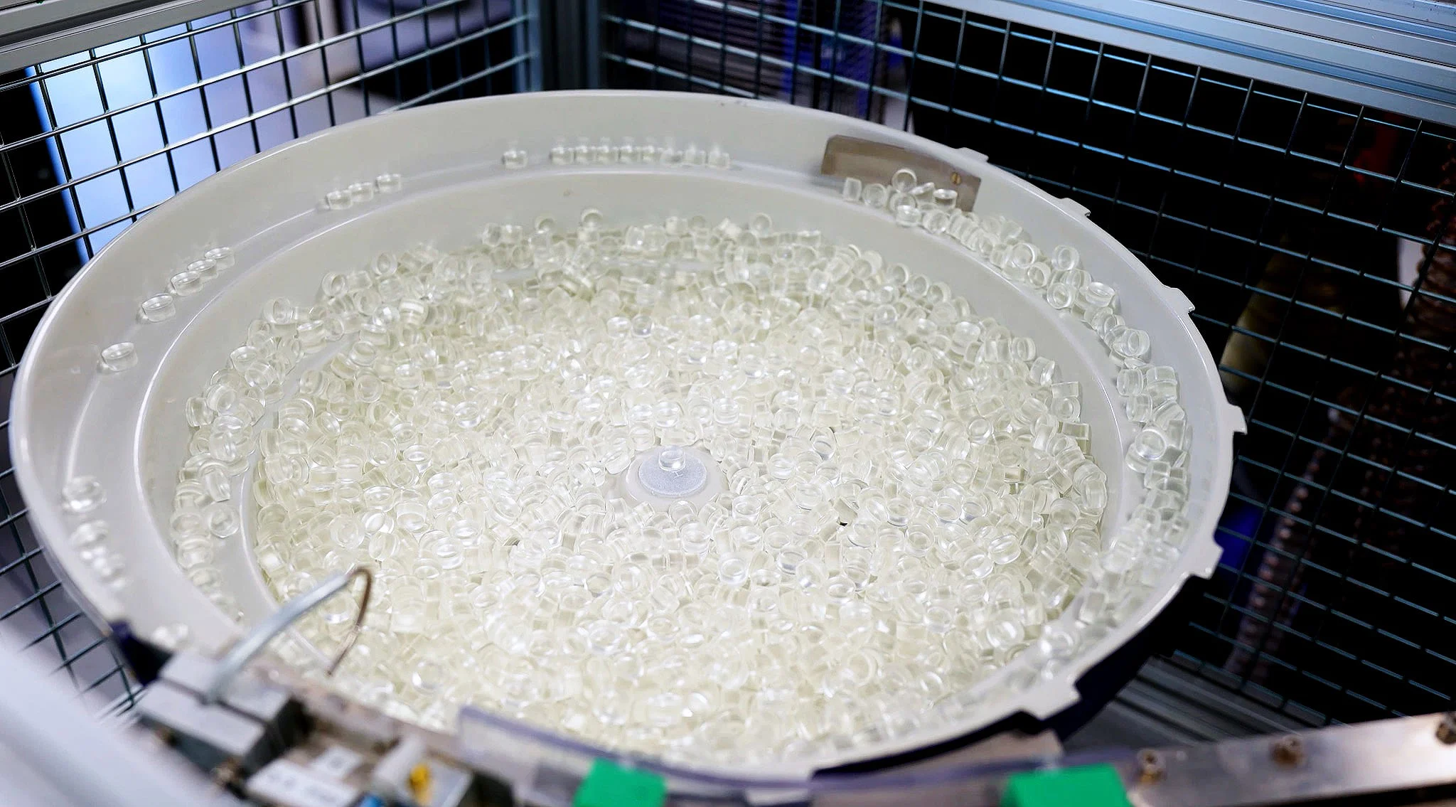 A bowl of raw contact lens buttons at Contamac's manufacturing site