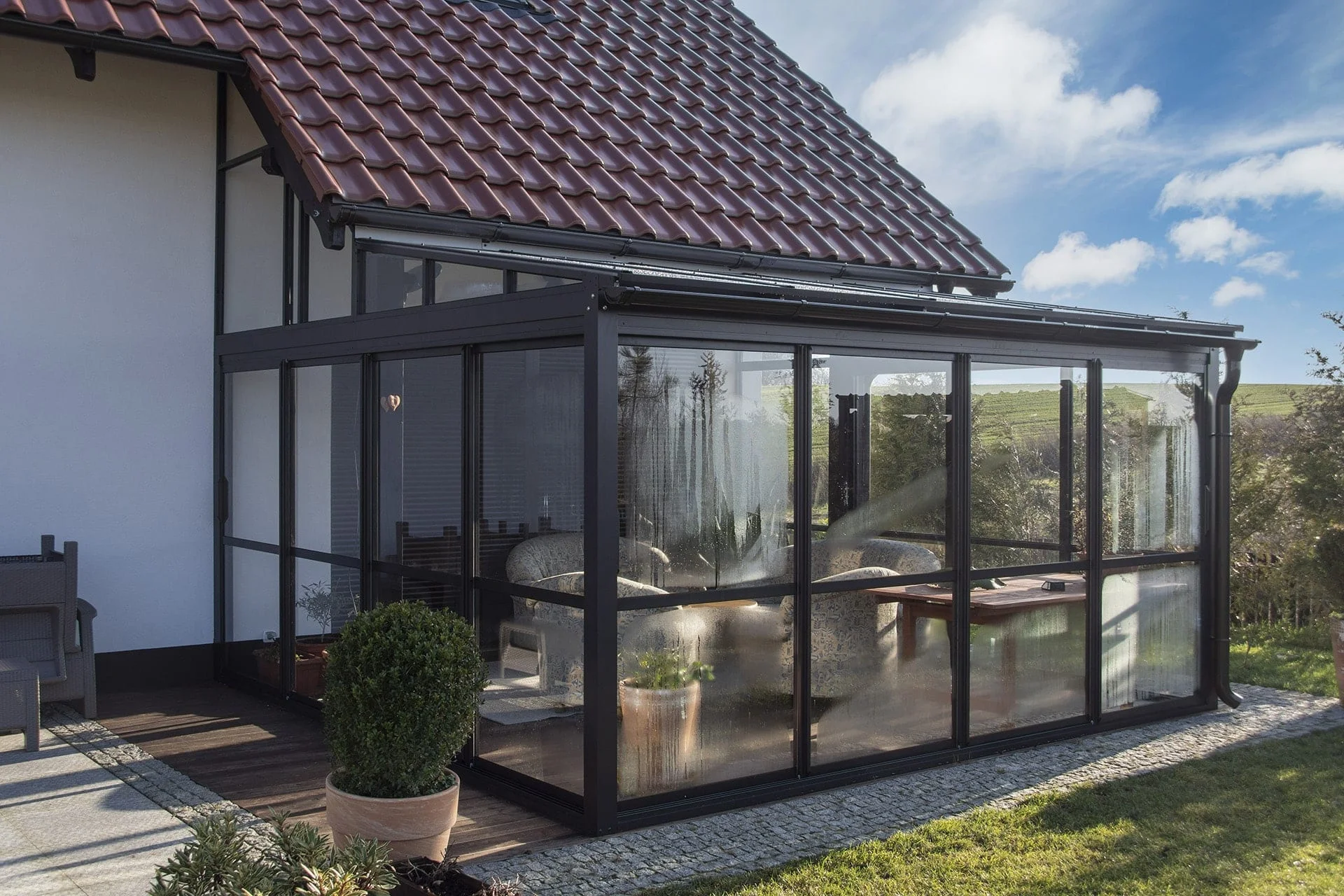 A terrace enclosed with Copal's framed aluminum glazing system