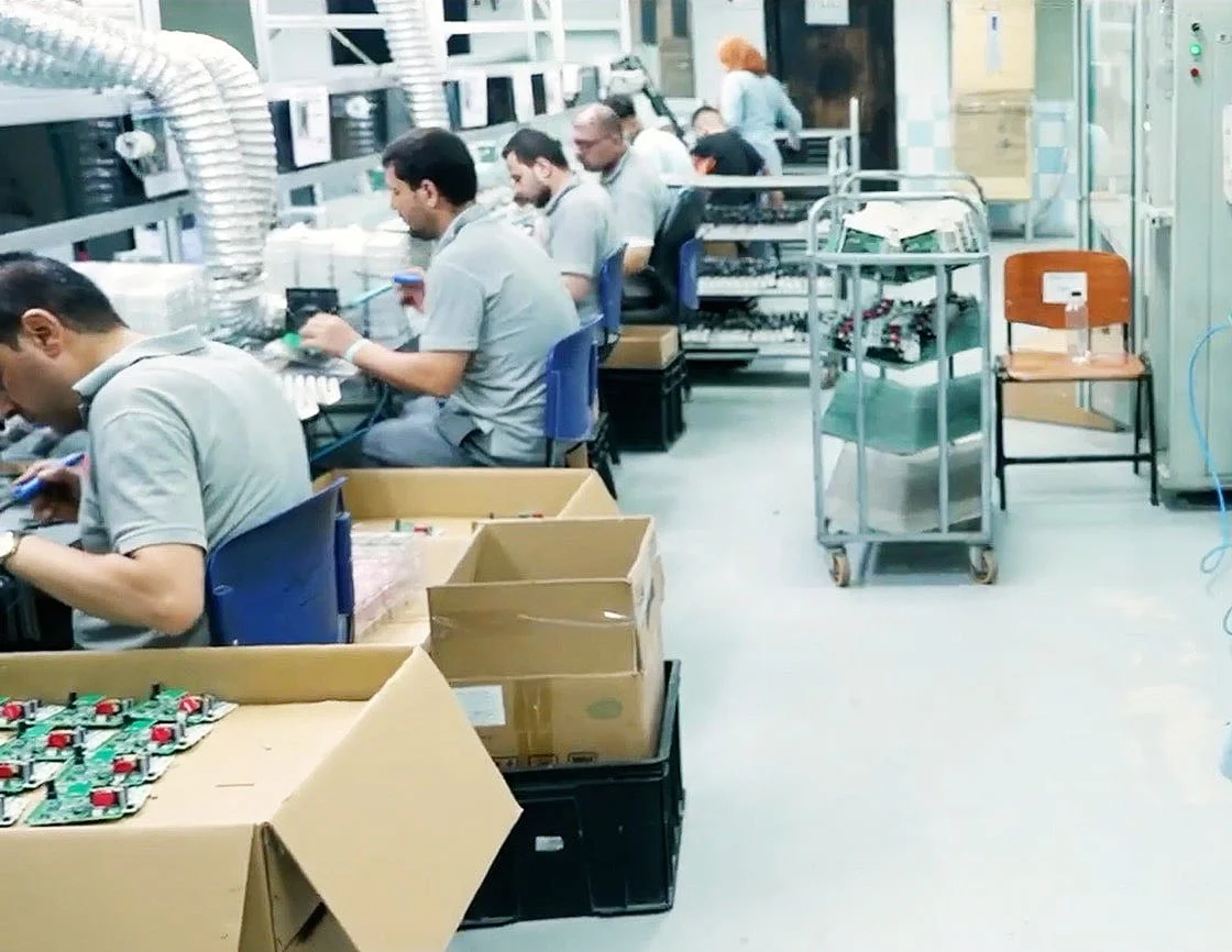 El Sewedy Electrometer employees assembling meters on the production floor