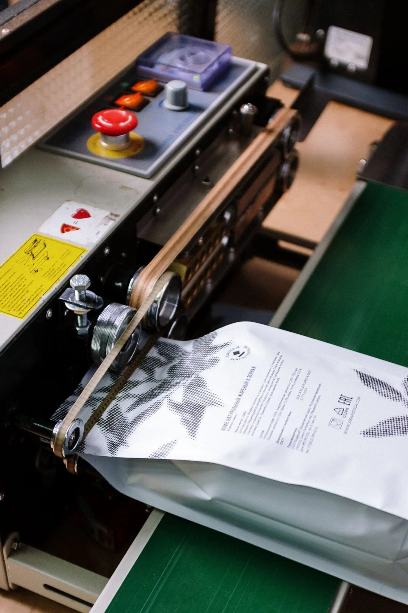 A packaging machine sealing a stand-up pouch