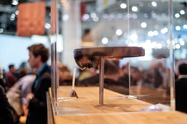 A HoloLens holographic headset on display in a glass case at a trade fair