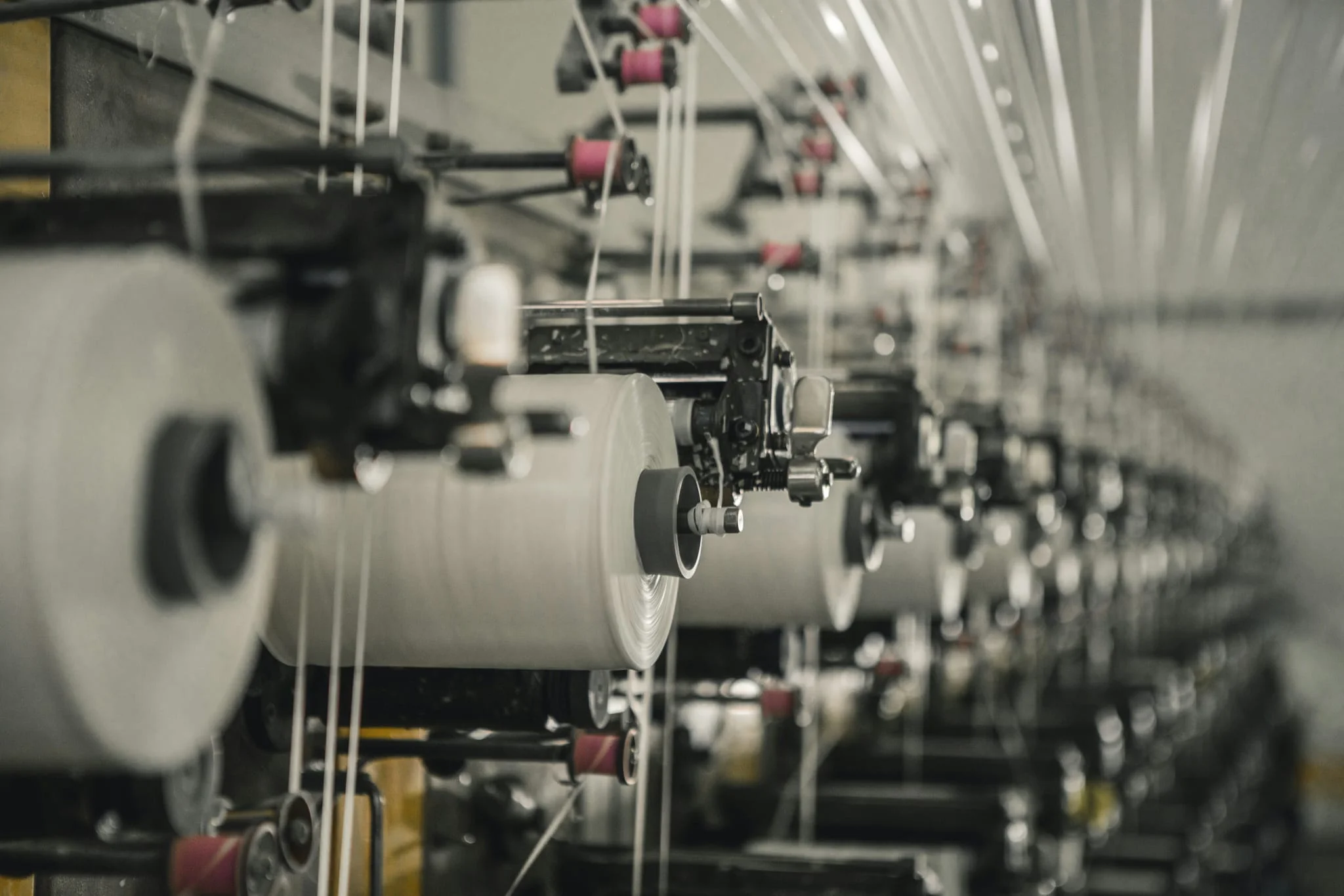 Rolls of material on an industrial textile machine