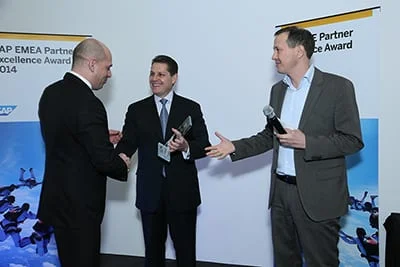 Lukasz Chomin, CEO of CompuTec, receiving the SAP EMEA Partner Excellence Award 2014 on stage