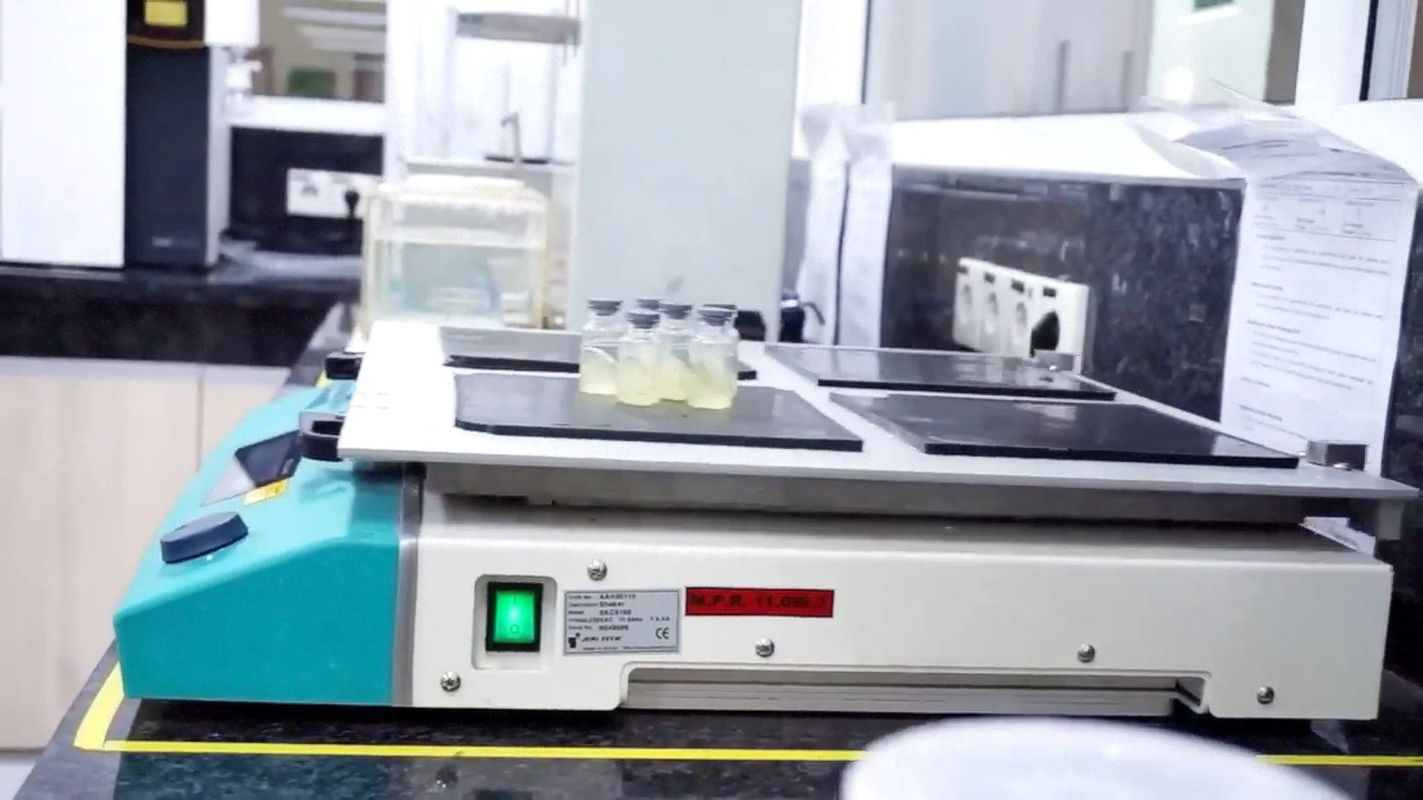 Quality control testing equipment with sample vials in Meprofarm's laboratory