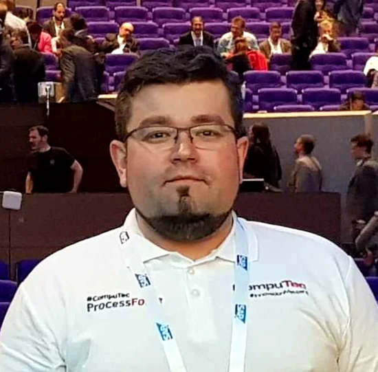 Michal Huzarski, Lead Developer for web and mobile solutions at CompuTec, at a conference venue