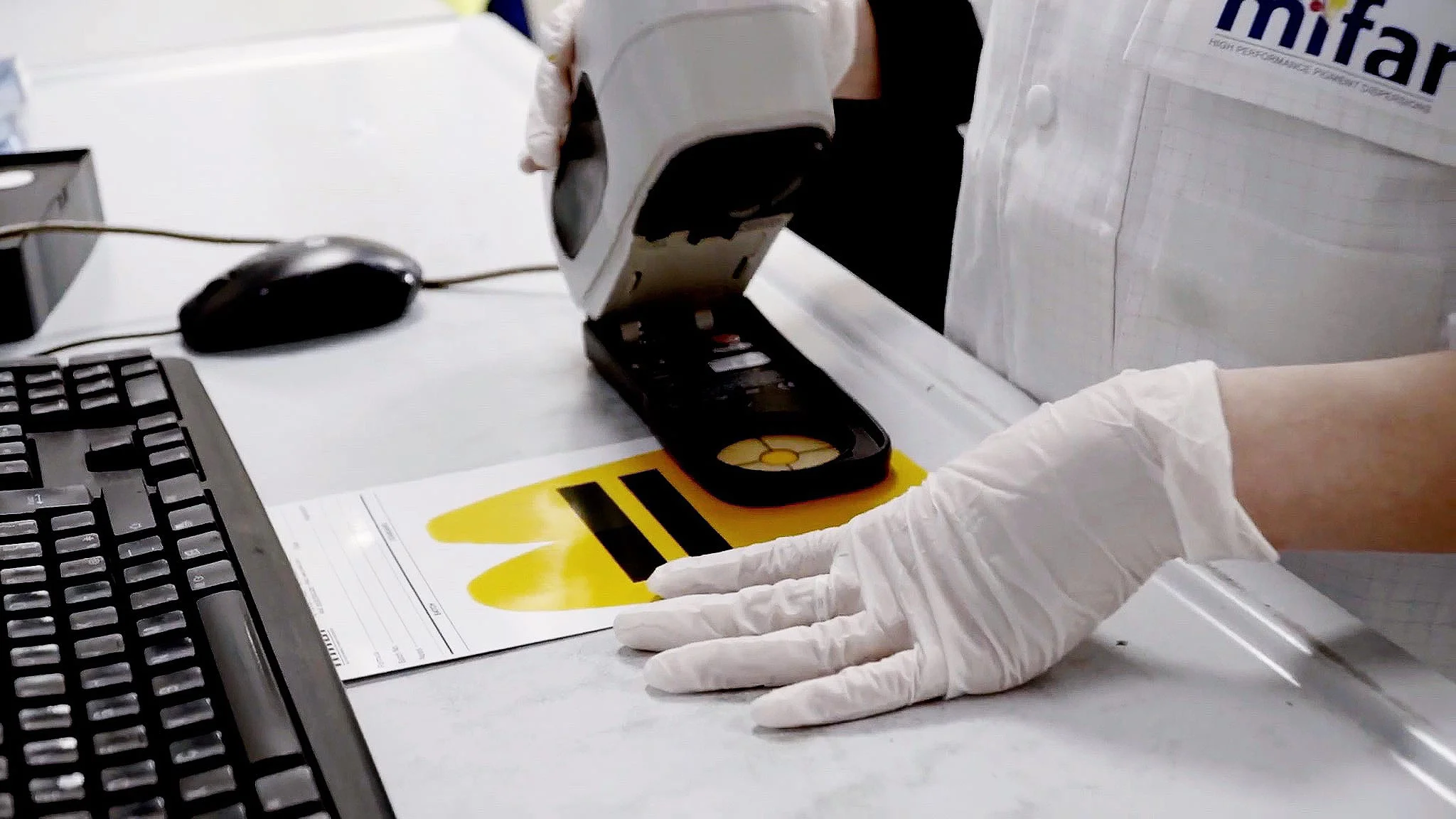 A colorimeter measuring a yellow color sample
