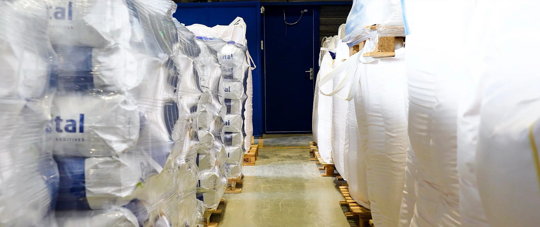 Finished Palital Feed Additives products stored in bulk bags in the warehouse