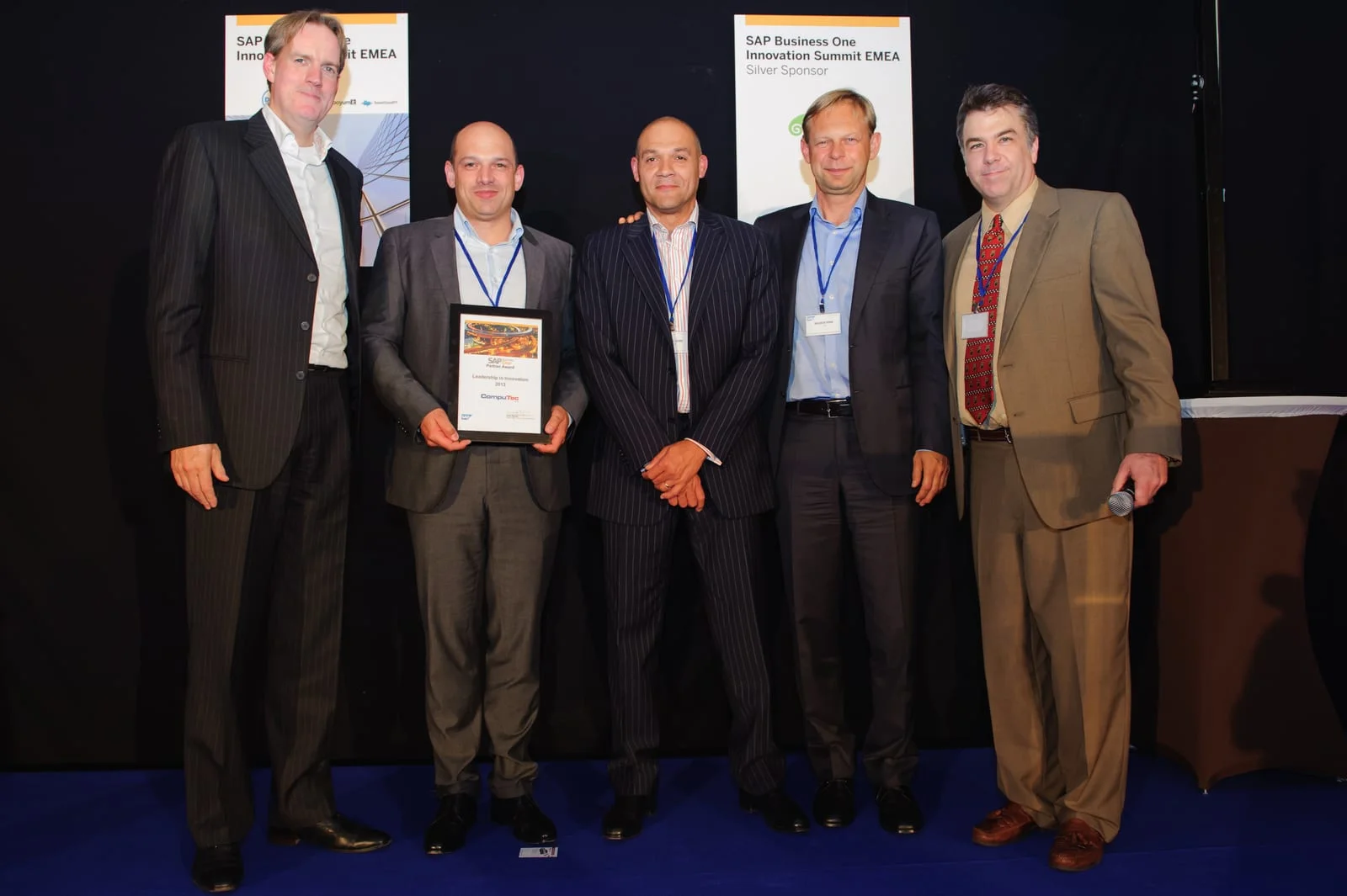CompuTec and SAP representatives on stage with the SAP Partner Award for Leadership in Innovation 2013