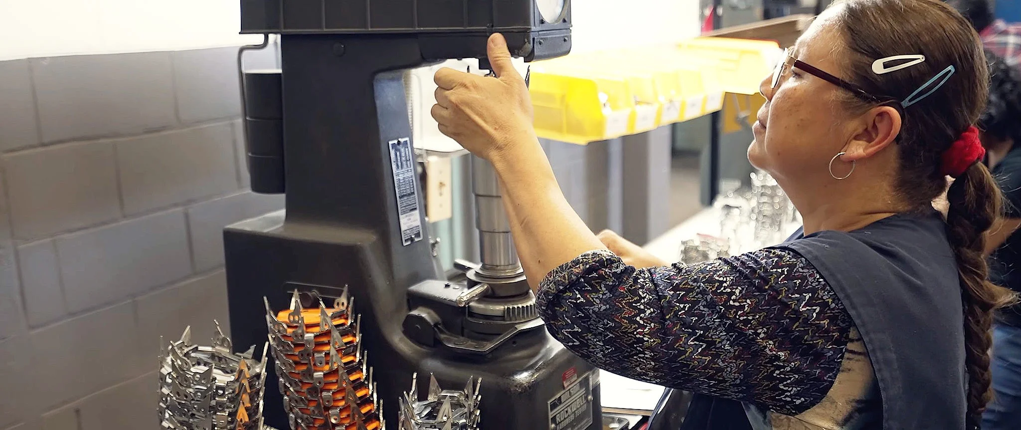 A Trans-Continental Manufacturing employee performing quality inspection