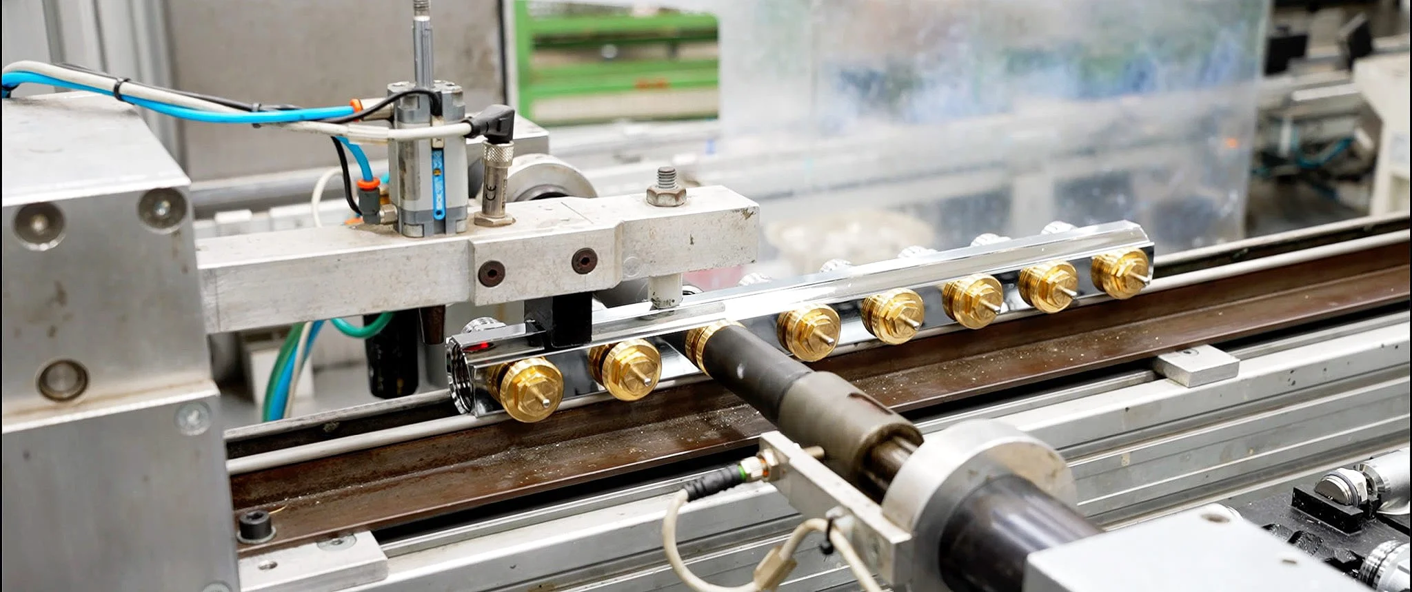 Brass fittings being assembled on a production line