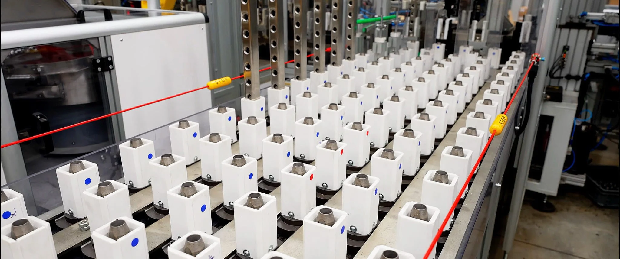 Rows of manifold components lined up on a production line